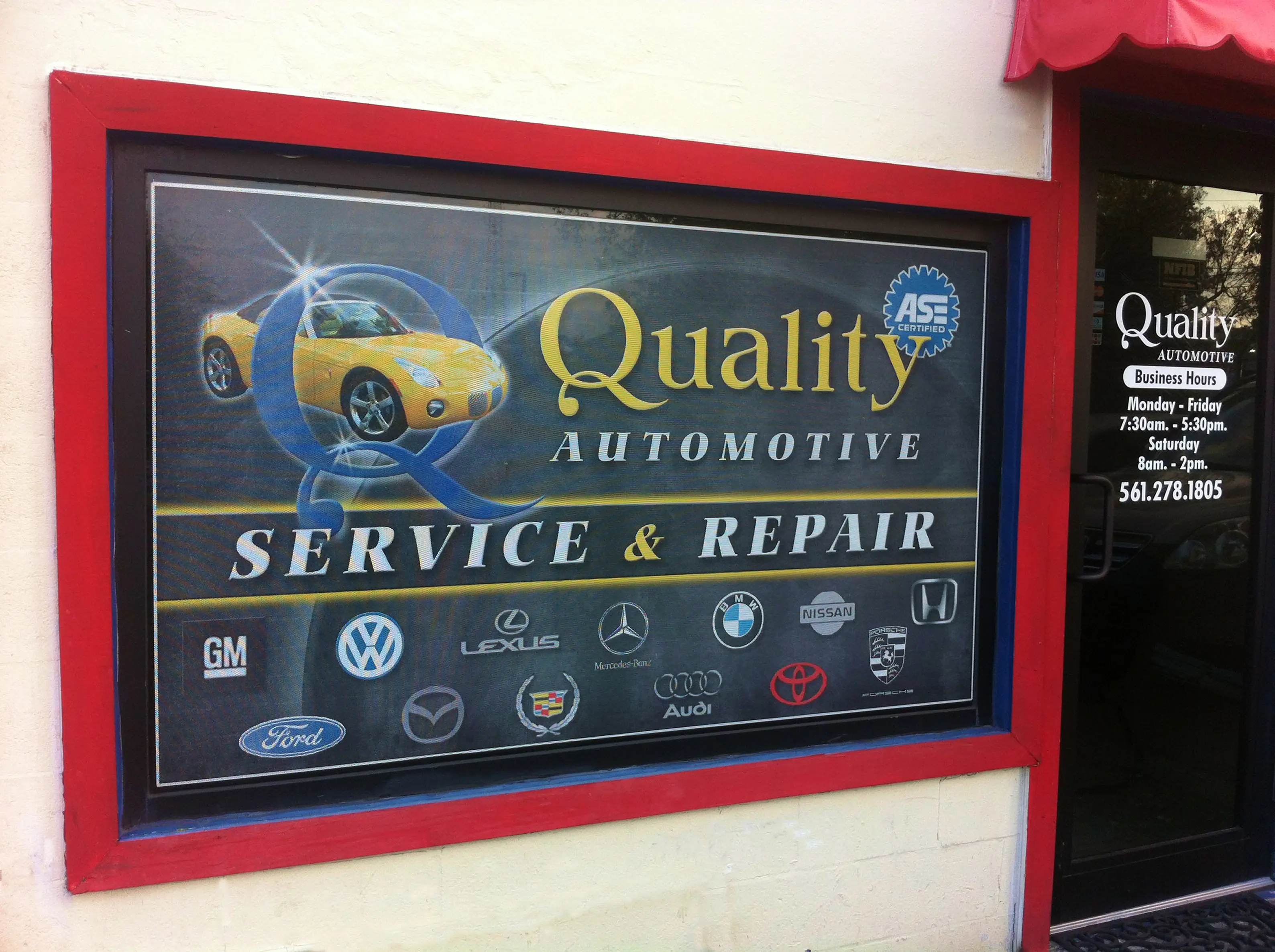 Perforated graphics example showing a car service business window
